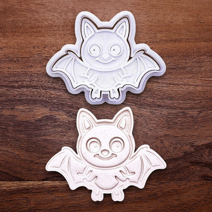 Bat cookie cutter with matching stamp and cutout, perfect for spooky Halloween cookies, fondant crafts, and gothic-themed baking projects.