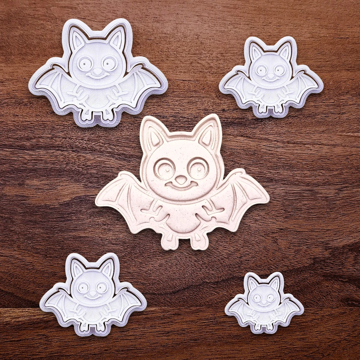 Bat cookie cutters with matching stamps and cutout, perfect for spooky Halloween cookies, fondant crafts, and gothic-themed baking projects.
