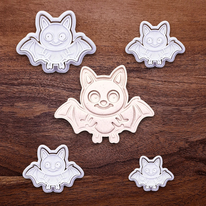 Bat cookie cutters with matching stamps and cutout, perfect for spooky Halloween cookies, fondant crafts, and gothic-themed baking projects.