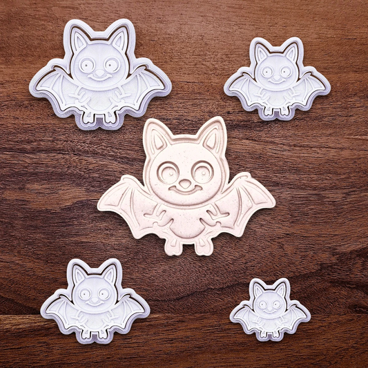 Bat cookie cutters with matching stamps and cutout, perfect for spooky Halloween cookies, fondant crafts, and gothic-themed baking projects.