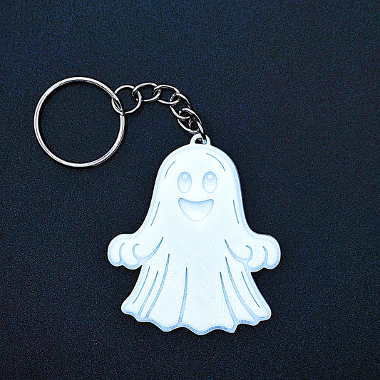 Front of white happy ghost keychain, cute spooky Halloween bag charm, handmade eco-friendly ghost key ring perfect for keys, gifts, or trick-or-treat.