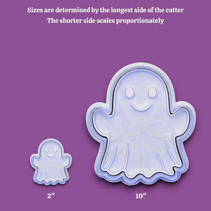 Two ghost-shaped cookie cutters shown on a purple background, one small labeled 2 inches and one large labeled 10 inches, with text at the top explaining size determination by the longest side.