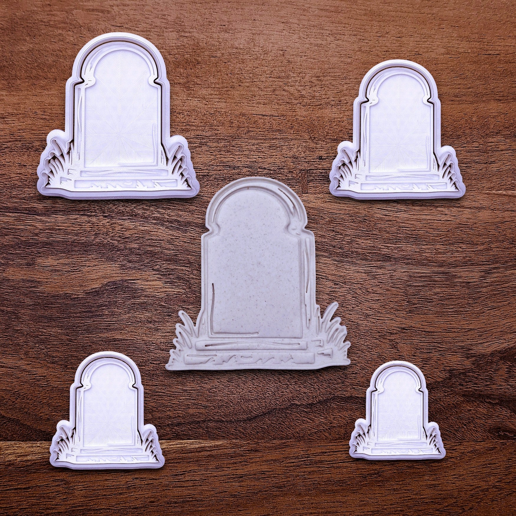 Gravestone cookie cutters and stamps in multiple sizes for eerie, easy-to-decorate cookies or creepy fondant toppers.