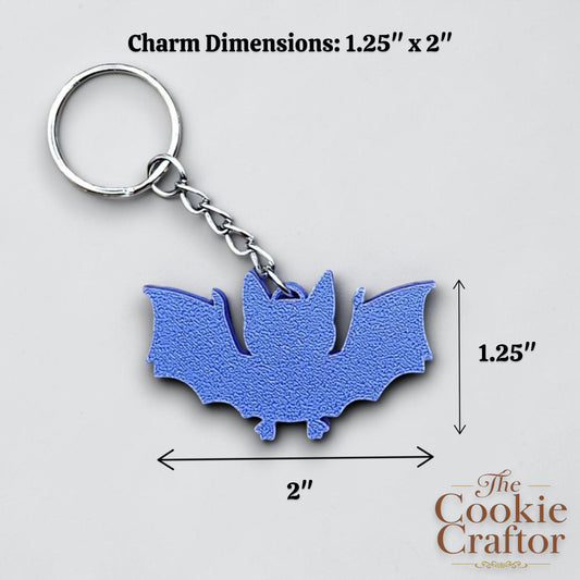 Handmade and customizable bat keychains in four colors, perfect for Halloween trick or treats, gothic party favors, and bat-themed accessories.