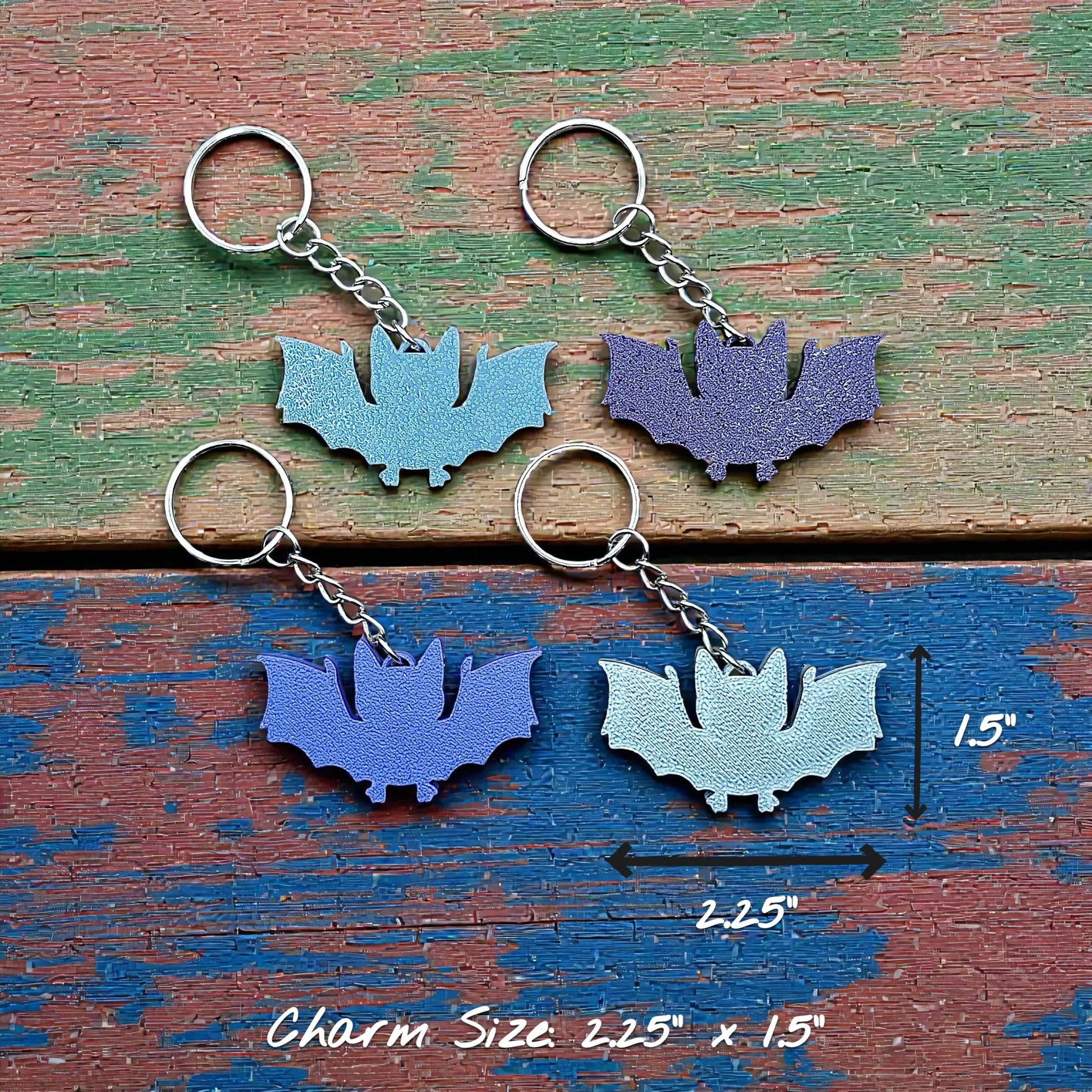 Handmade and customizable bat keychains in four colors, perfect for Halloween trick or treats, gothic party favors, and bat-themed accessories.