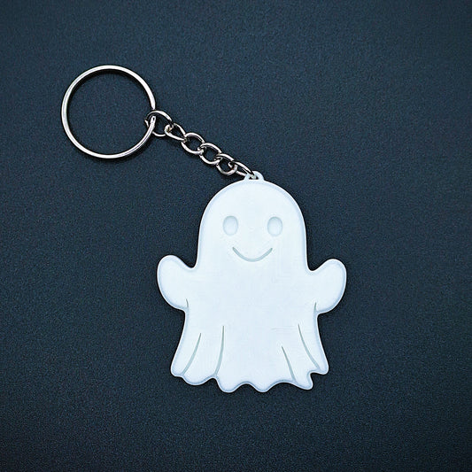 Single white ghost keychain—cute, spooky charm made from sustainable PLA plastic; ideal Halloween accessory, party favor, or zipper pull.