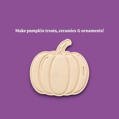 Pumpkin cookie dough cutout with stamped details from the cutter and stamp set; demonstrates textured lines and stem impression.