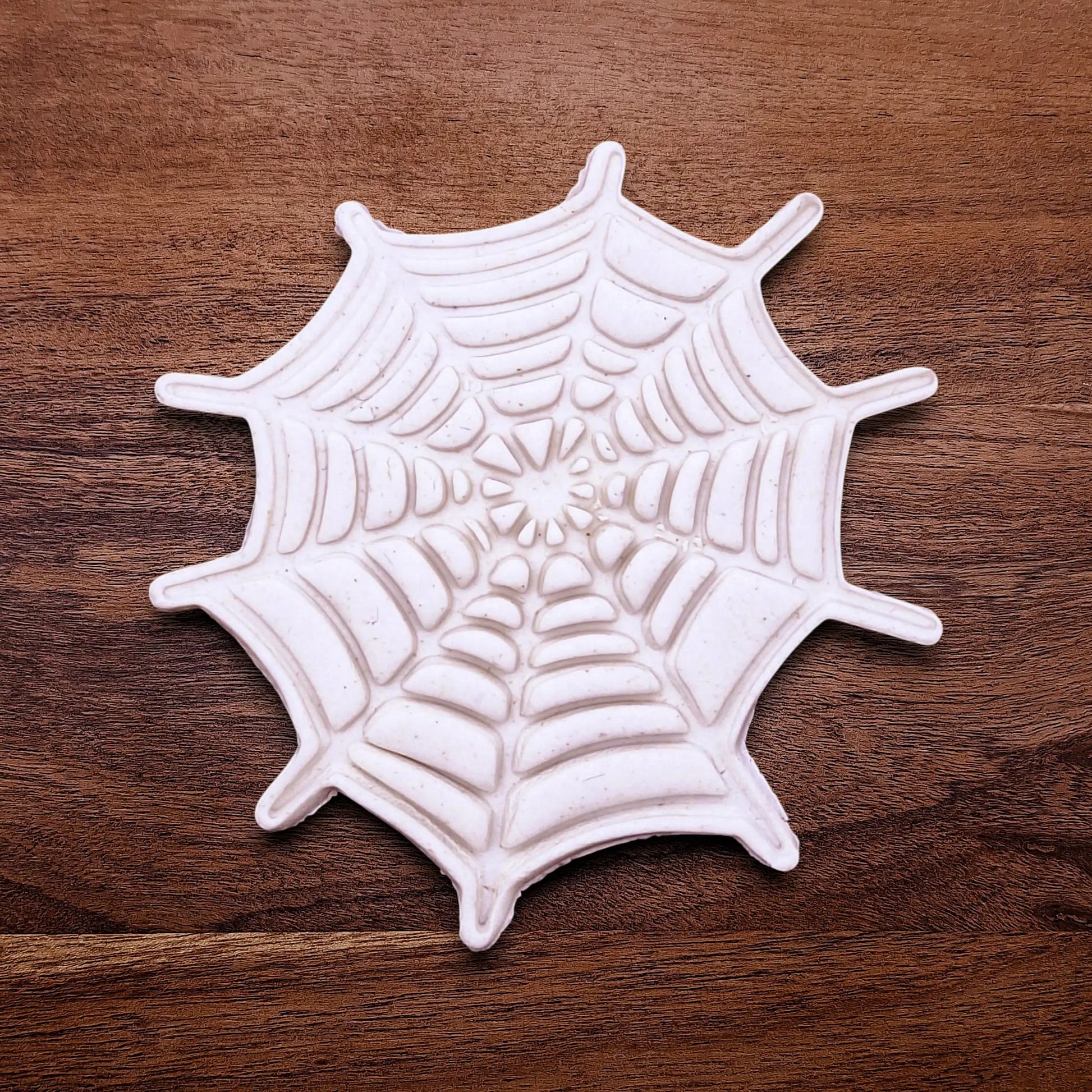 Handmade and customizable Halloween spiderweb dough cutout and imprint, perfect for fall parties, events, trick or treats, and gifting.