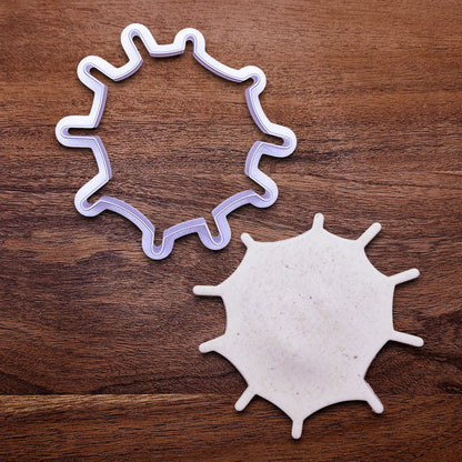 Handmade and customizable Halloween spiderweb cookie cutters alongside a spiderweb dough cutout, perfect for fall parties, events, trick or treats, and gifting.