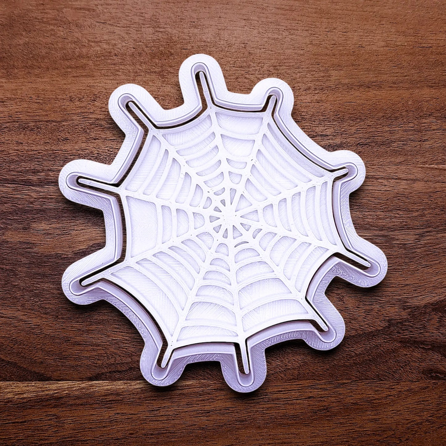 Handmade and customizable Halloween spiderweb cookie cutter and stamp, perfect for fall parties, events, trick or treats, and gifting.