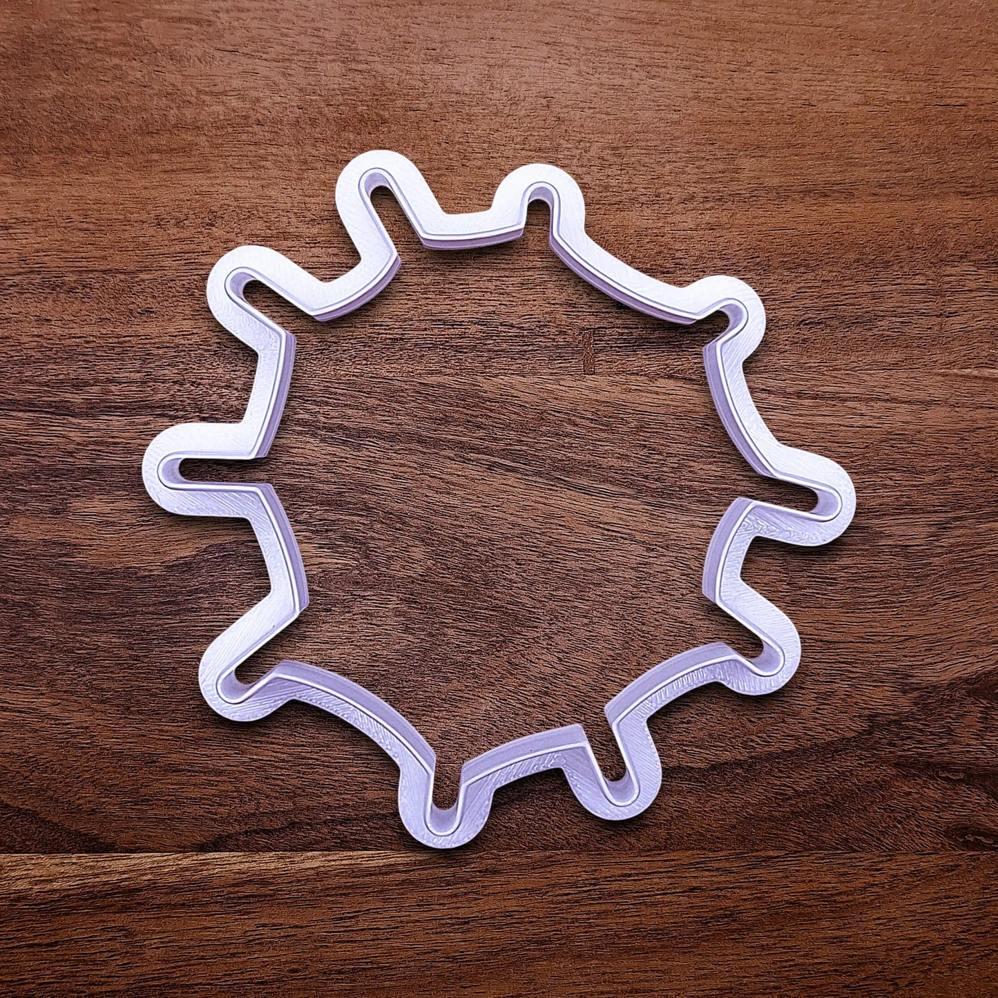 Handmade and customizable Halloween spiderweb cookie cutter, perfect for fall parties, events, trick or treats, and gifting.