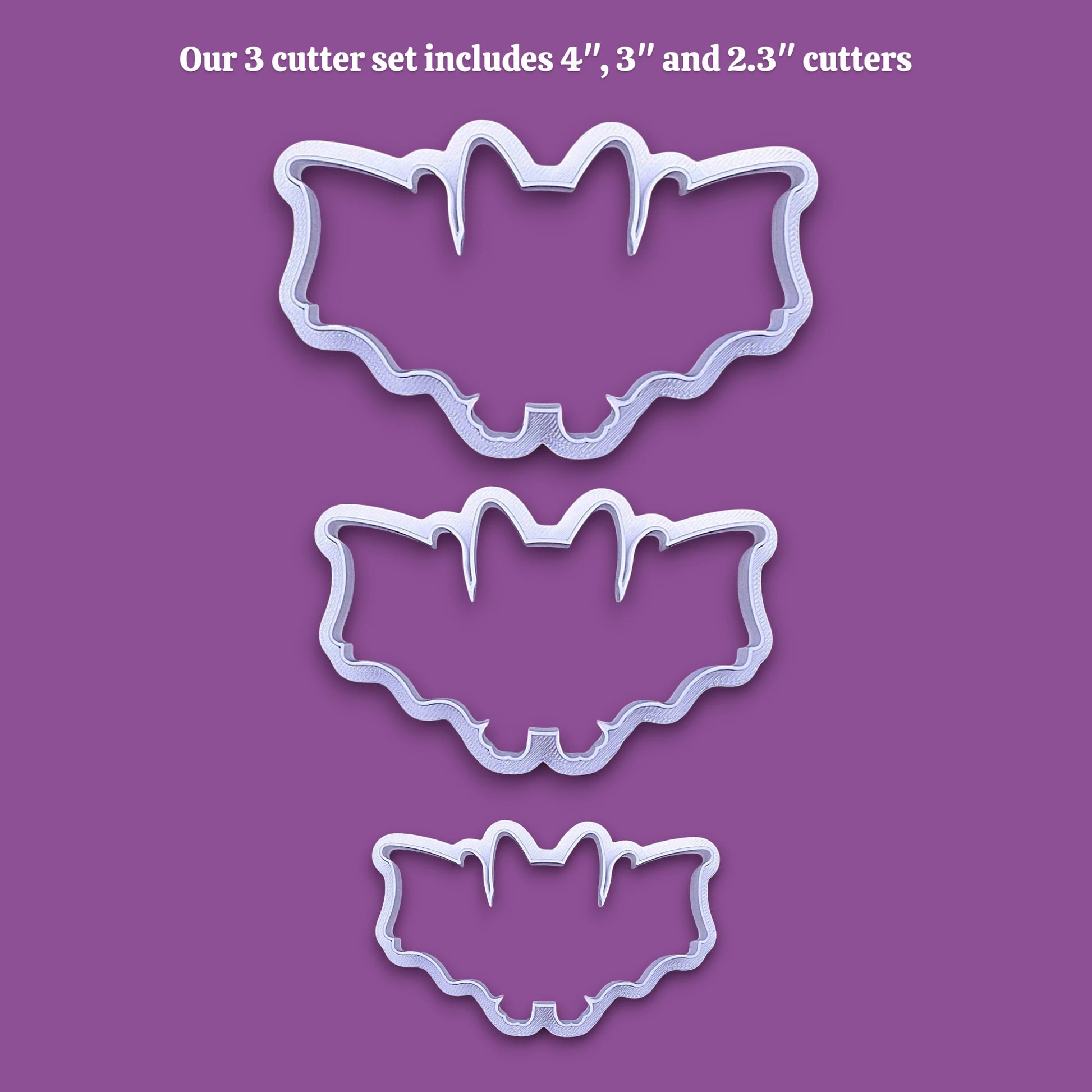 Three bat-shaped cookie cutters in sizes 4 inches, 3 inches, and 2.3 inches, shown as white plastic outlines on a solid purple background with white text at the top stating 'Our 3 cutter set includes 4", 3" and 2.3" cutters'