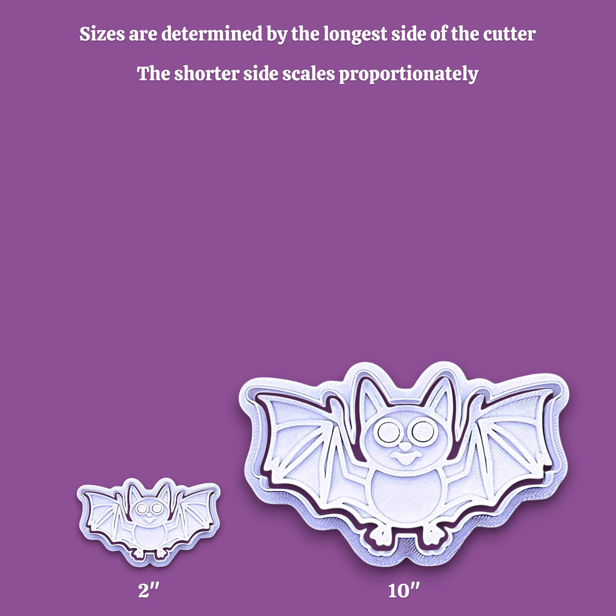 Bat-shaped cookie cutter shown in two sizes on a purple background, with text explaining that sizes are determined by the longest side of the cutter and that the shorter side scales proportionately. The larger cutter is labeled 10 inches and the smaller one 2 inches.