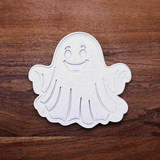 Ghost cookie dough cutouts with smiling face and floating arms. Perfect for cute Halloween treats, fall parties, or baking with kids.