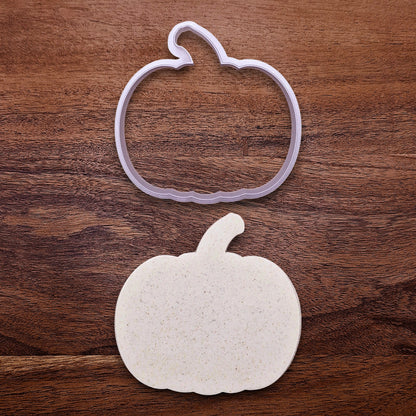 Pumpkin cookie cutter alongside a dough cutout, perfect for baking big autumn cookies, decorating pies, or crafting with fondant or clay.