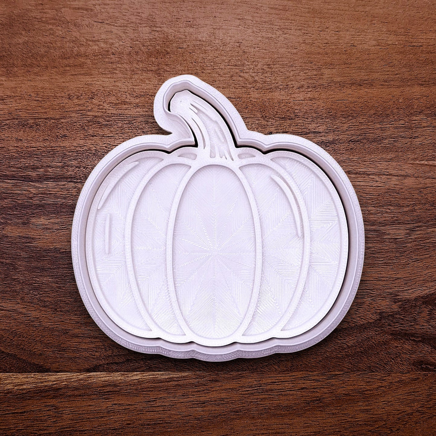 Pumpkin cookie cutter with matching stamp for detailed fall treats. Great for cookies, fondant, pie decorations, and festive baking projects.
