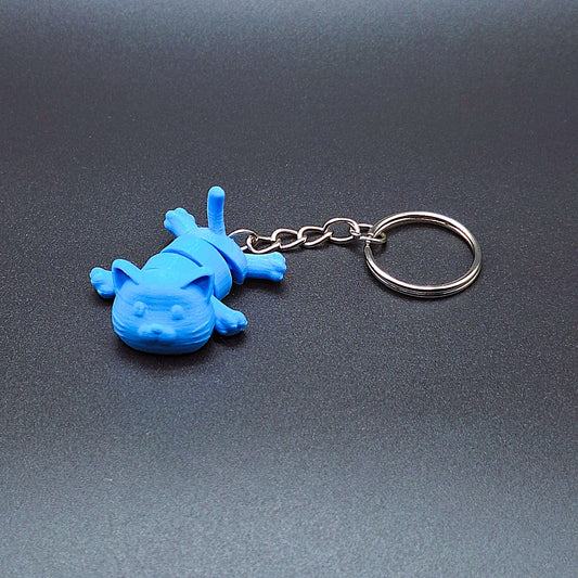 Front view of articulated cat keychain in cyan with moving legs and tail, perfect for cat lovers and fidget fans.