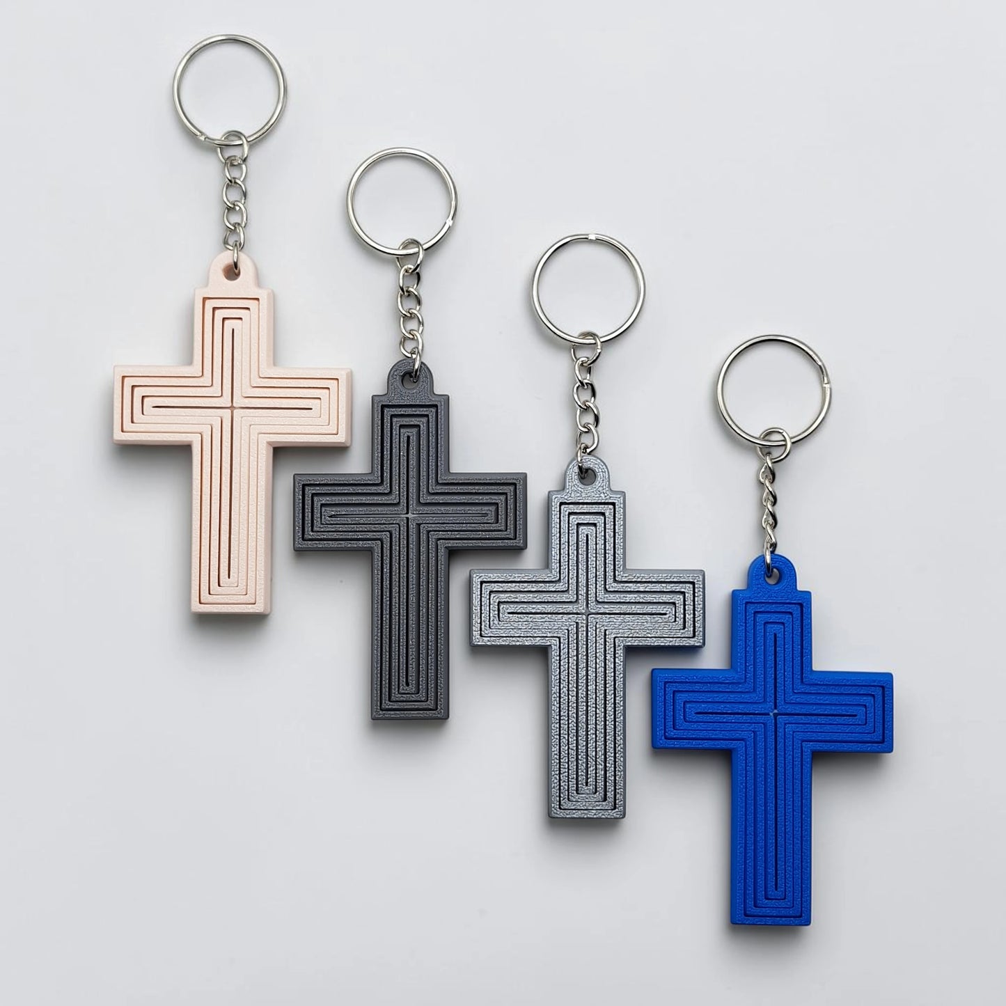 Handmade and customizable articulated cross keychains in various colors, ideal for personalized gifts, church events, VBS, and faith-based accessories.