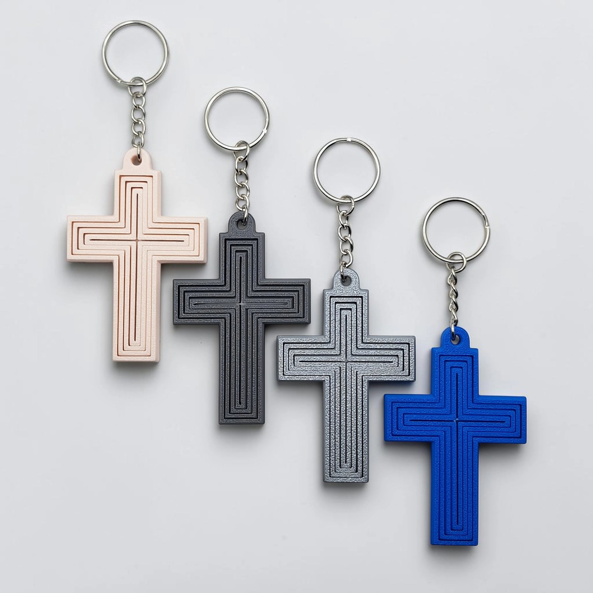 Handmade and customizable articulated cross keychains in various colors, ideal for personalized gifts, church events, VBS, and faith-based accessories.