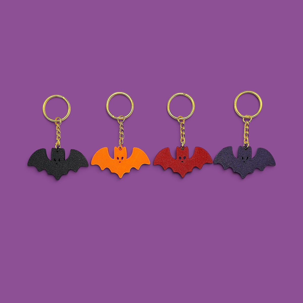 Colorful customizable Halloween bat keychains - eco-friendly spooky charms, perfect for Halloween gifts, party favors, or gothic-themed keyring collections.