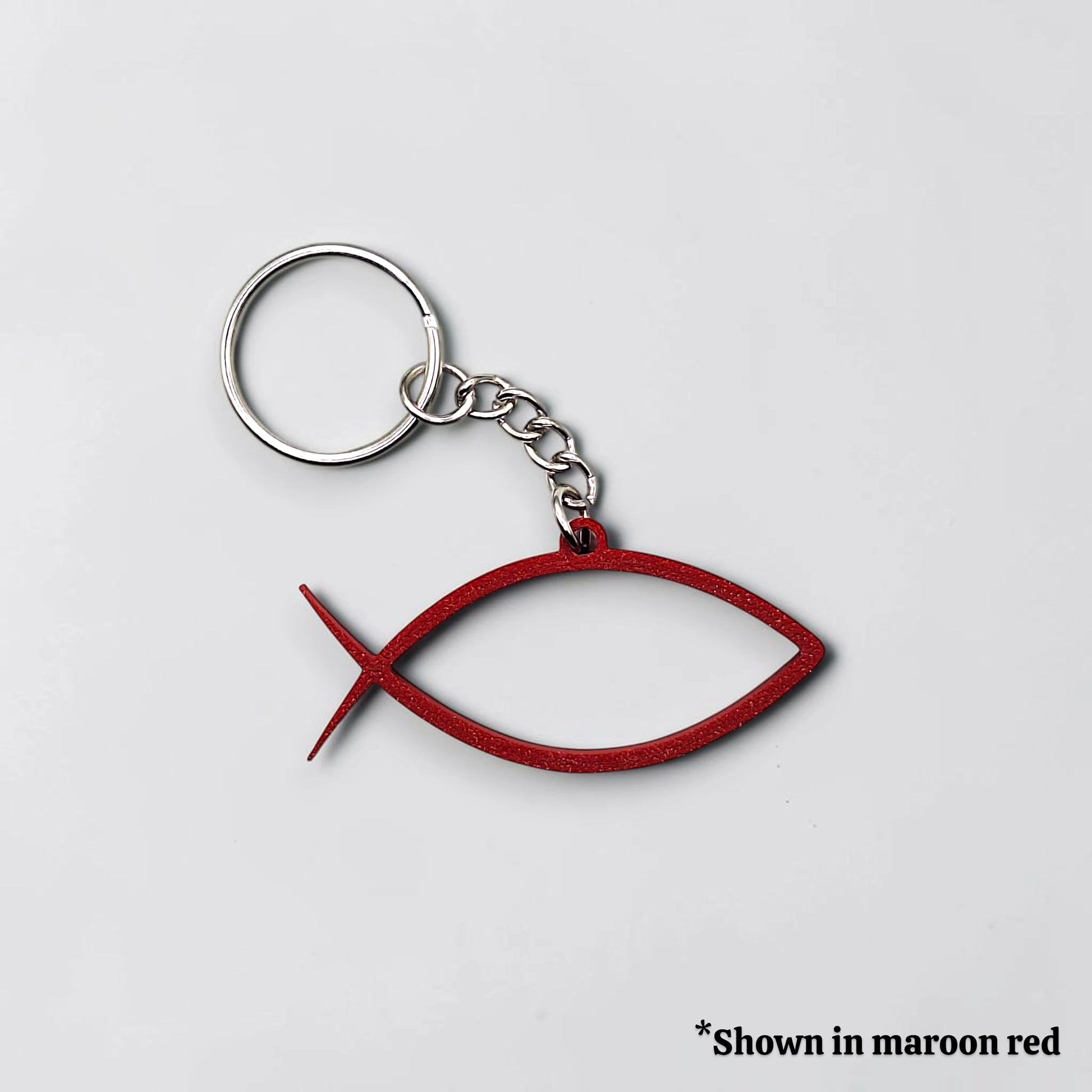 Handmade and customizable Ichthys Fish Keychains in maroon red, inspirational religious charms for Easter gifts, VBS giveaways, and church favors.