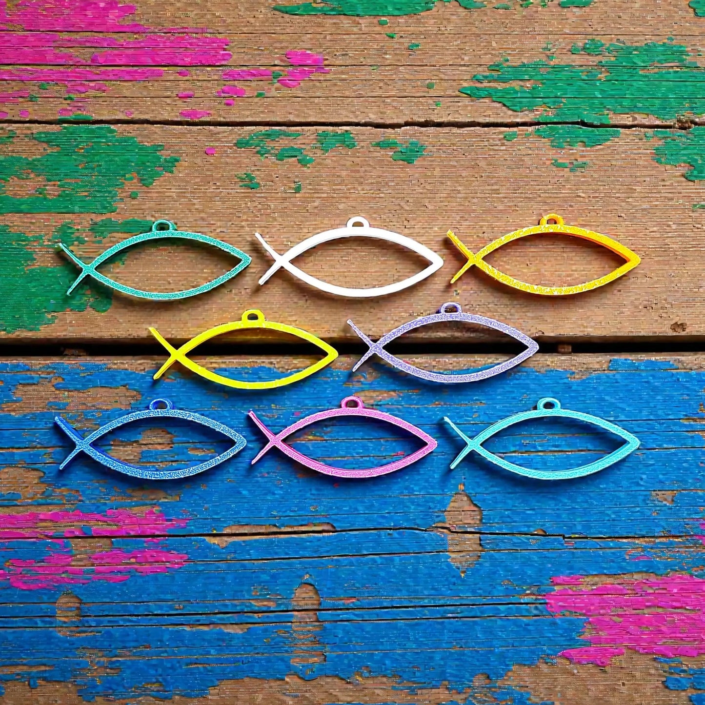 Handmade and customizable Ichthys Fish Keychains in unique colors, inspirational religious charms for Easter gifts, VBS giveaways, and church favors.