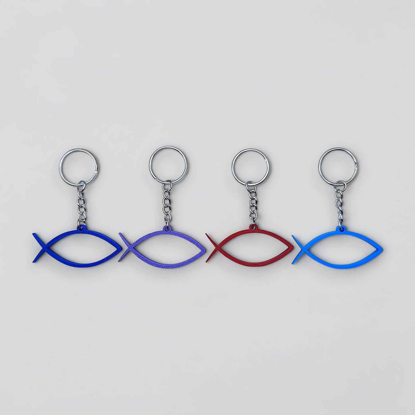 Handmade and customizable Ichthys Fish Keychains in unique colors, inspirational religious charms for Easter gifts, VBS giveaways, and church favors.