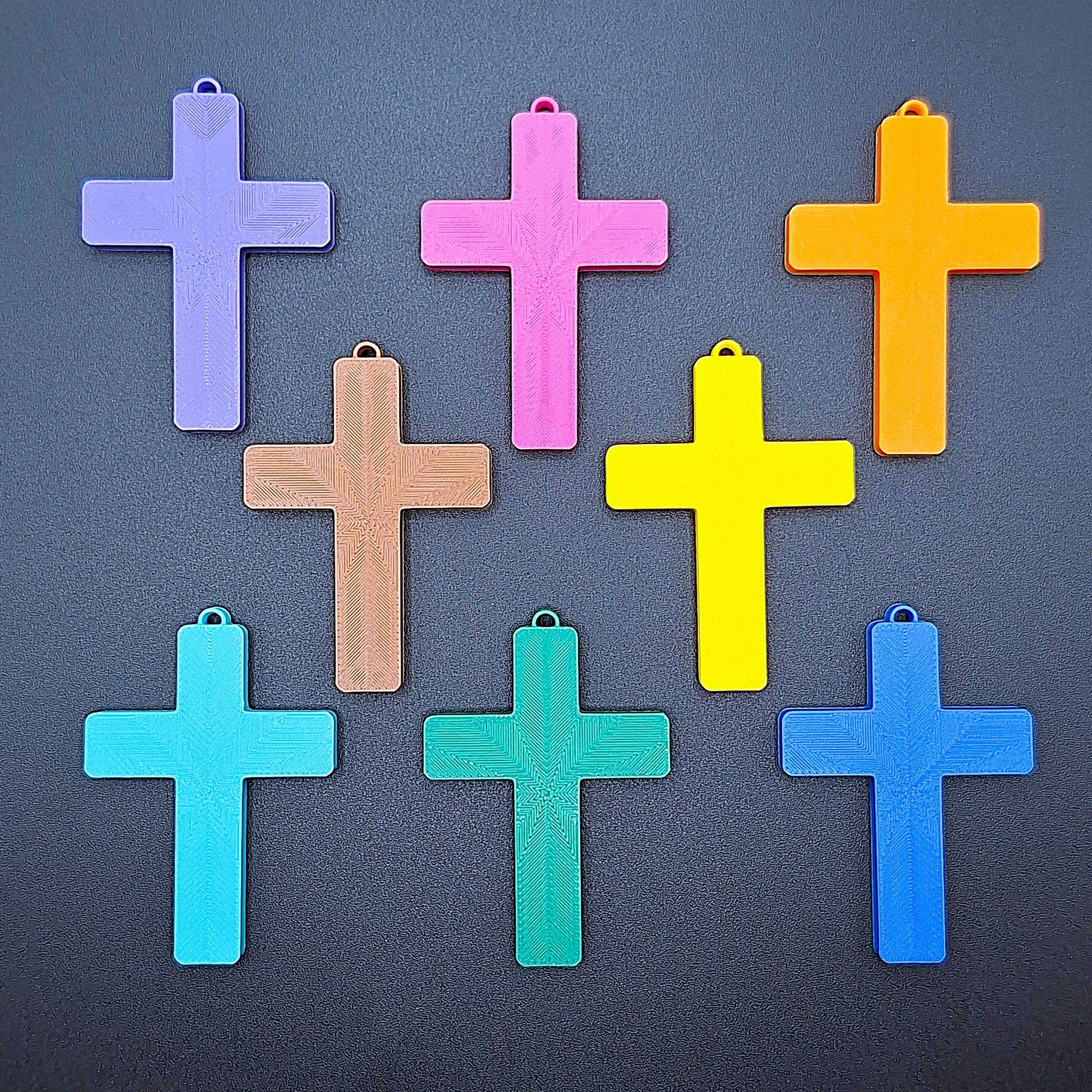 Front view of eight vibrant cross keychains, eco-friendly and handmade, ideal for VBS, church events, and meaningful faith-based gifts.