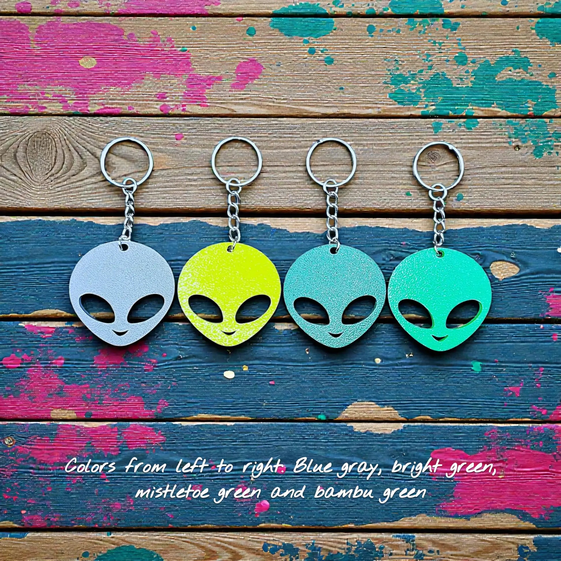 Alien head keychains in different colors displayed side by side, perfect for sci-fi fans, party favors, or fun personalized gifts.