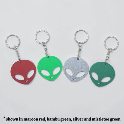 Alien head keychains in different colors displayed side by side, perfect for sci-fi fans, party favors, or fun personalized gifts.