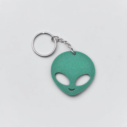 Alien head keychain in mistletoe green, perfect for sci-fi fans, party favors, or fun personalized gifts.