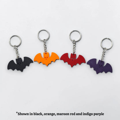 Handmade and customizable bat keychains in unique colors, perfect for Halloween gifts, party favors, or gothic-themed keyring collections.