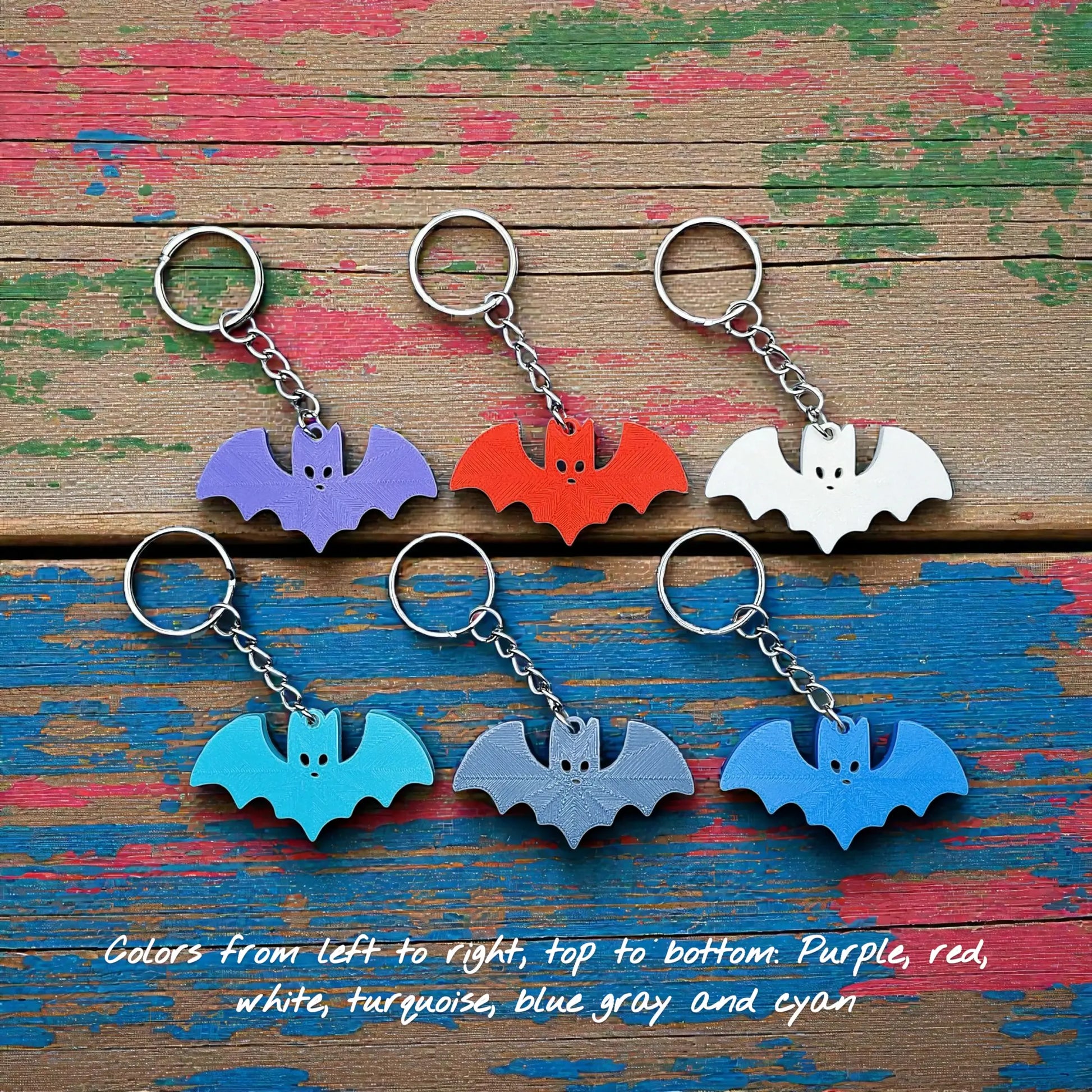Handmade and customizable bat keychains in unique colors, perfect for Halloween gifts, party favors, or gothic-themed keyring collections.