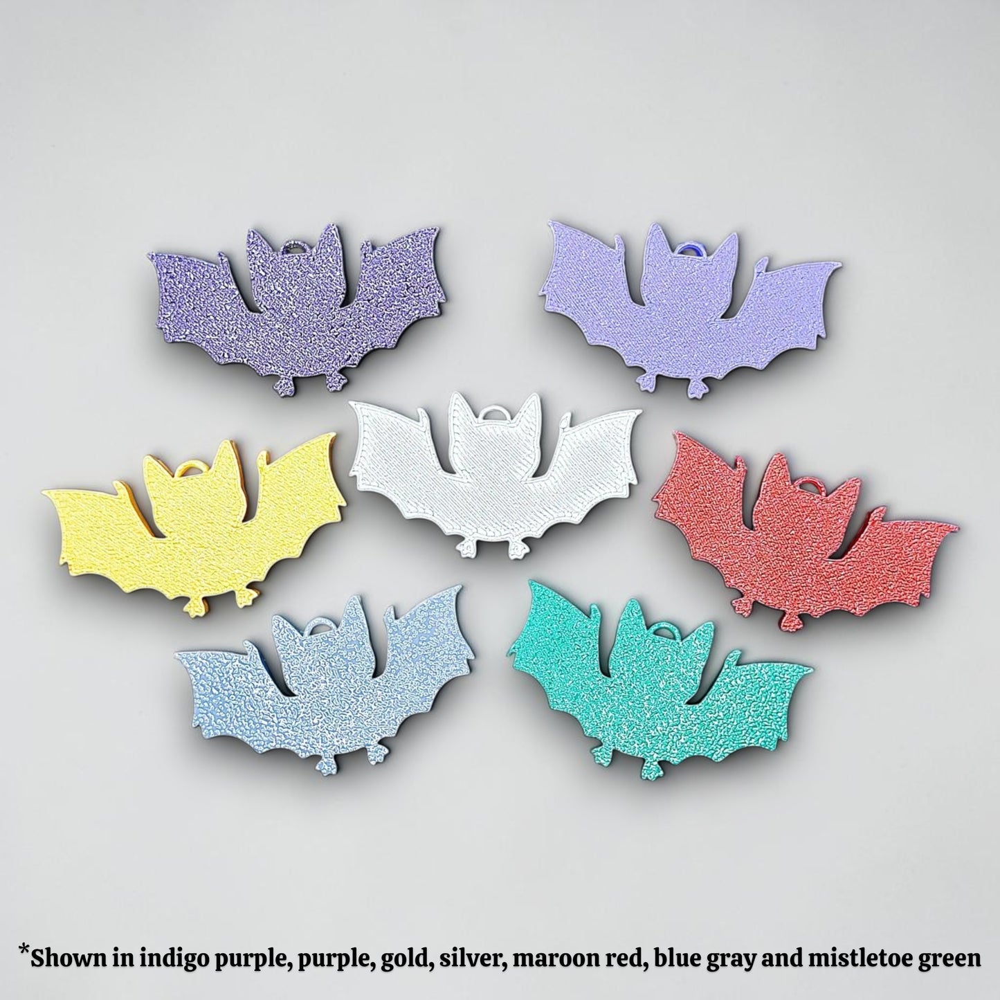 Handmade and customizable bat keychains, perfect for Halloween trick or treats, gothic party favors, and bat-themed accessories.