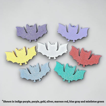 Handmade and customizable bat keychains, perfect for Halloween trick or treats, gothic party favors, and bat-themed accessories.
