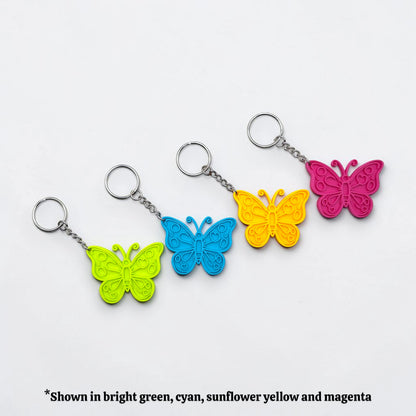 Handmade and customizable butterfly keychains in eight colors, perfect for gifts, party favors, or nature-themed accessories.
