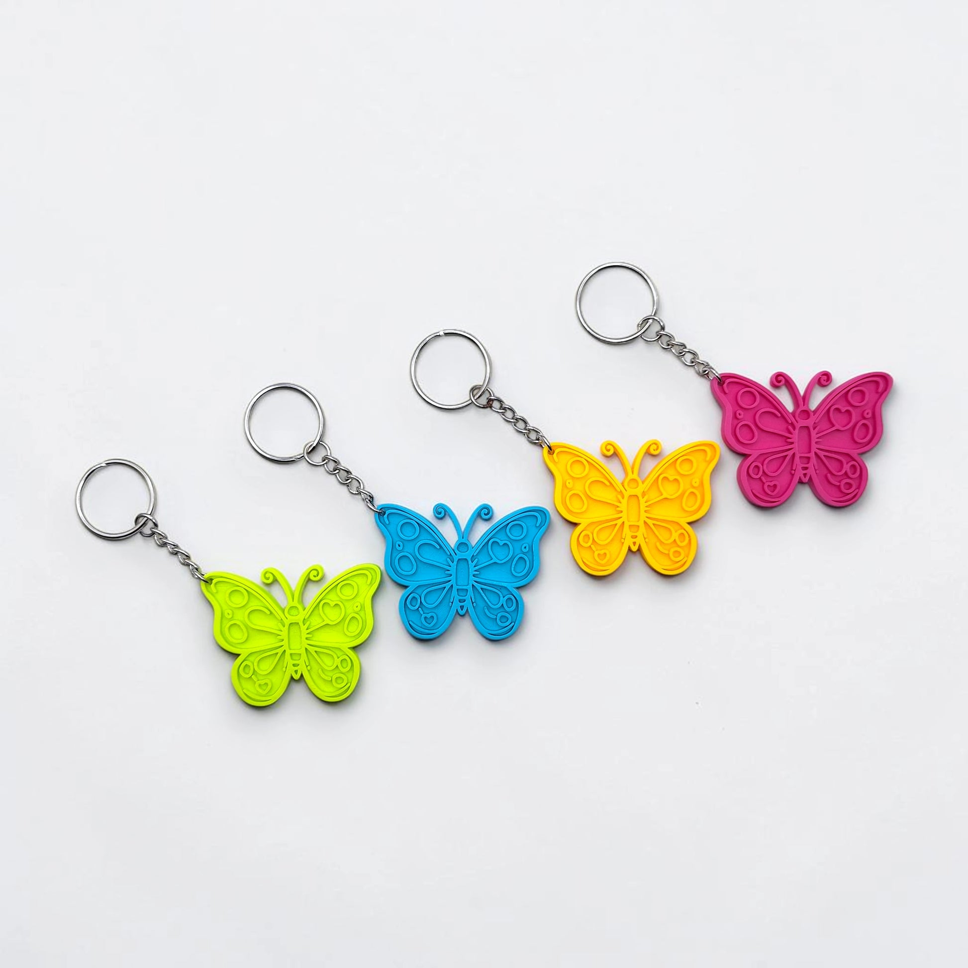 Handmade and customizable butterfly keychains in various colors, perfect for gifts, party favors, or nature-themed accessories.