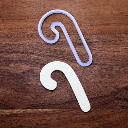 Handmade and customizable Christmas holiday Candy Cane Cookie Cutter alongside a dough cutout - perfect for Christmas cookies, festive gifts, and fun seasonal family baking activities.