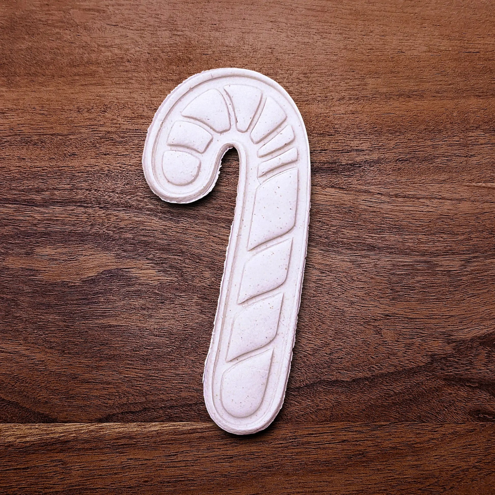 Handmade and customizable Candy Cane Christmas Cookie Cutter and Stamp dough cutout and imprint - adds festive striped detail for easy holiday baking and decorating treats, available in 30 unique colors.