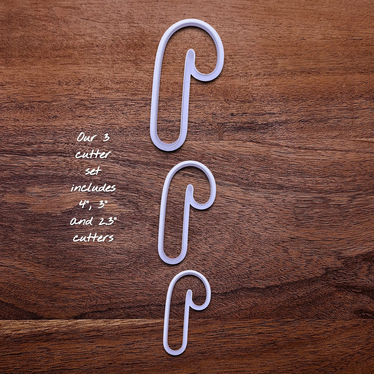 Handmade and customizable Candy Cane Christmas Cookie Cutter in 3 sizes - adds festive striped detail for easy holiday baking and decorating treats, available in 30 unique colors.