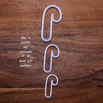Handmade and customizable Candy Cane Christmas Cookie Cutter in 3 sizes - adds festive striped detail for easy holiday baking and decorating treats, available in 30 unique colors.