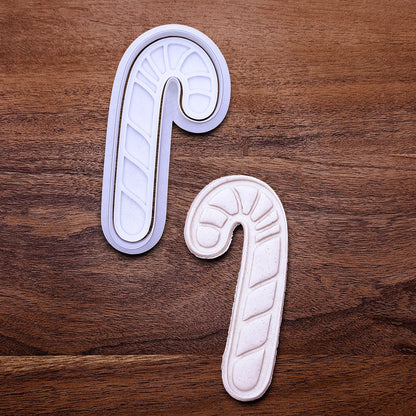 Handmade and customizable Candy Cane Christmas Cookie Cutter and Stamp with dough cutout and imprint - adds festive striped detail for easy holiday baking and decorating treats, available in 30 unique colors.