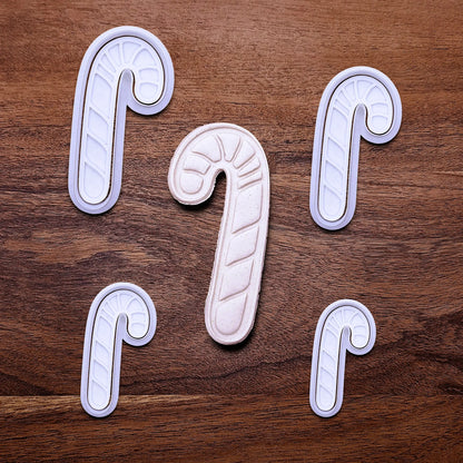 Handmade and customizable Candy Cane Christmas Cookie Cutter and Stamp set in multiple sizes - adds festive striped detail for easy holiday baking and decorating treats, available in 30 unique colors.