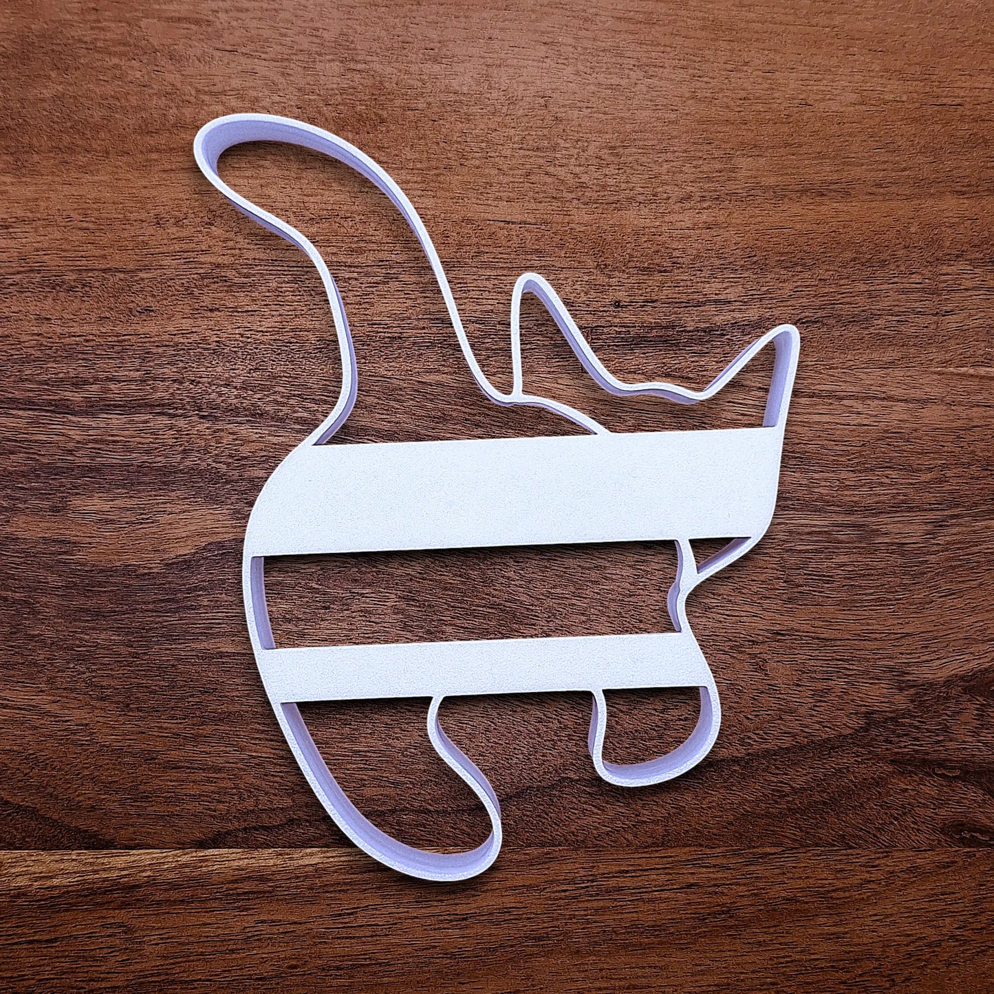 Reverse of handmade and customizable cat butt cookie cutter baking mold, perfect for gifting, gag gifts, white elephant gifting, and cat themed parties and treats.