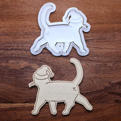 Funny Santa Hat Cat Butt Cookie Cutter and Stamp alongside a cat butt dough cutout and imprint, available in a 3-piece set or individual sizes, perfect for baking, fondant, crafts, gag gifts and white elephant parties.