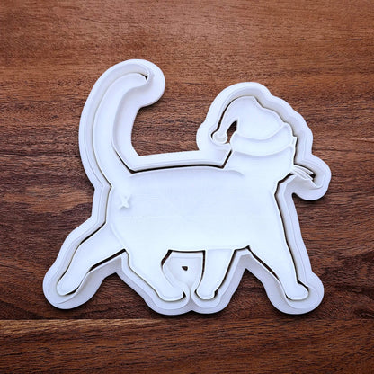 Funny Santa Hat Cat Butt Cookie Cutter and Stamp, available in a 3-piece set or individual sizes, perfect for baking, fondant, crafts, gag gifts and white elephant parties.