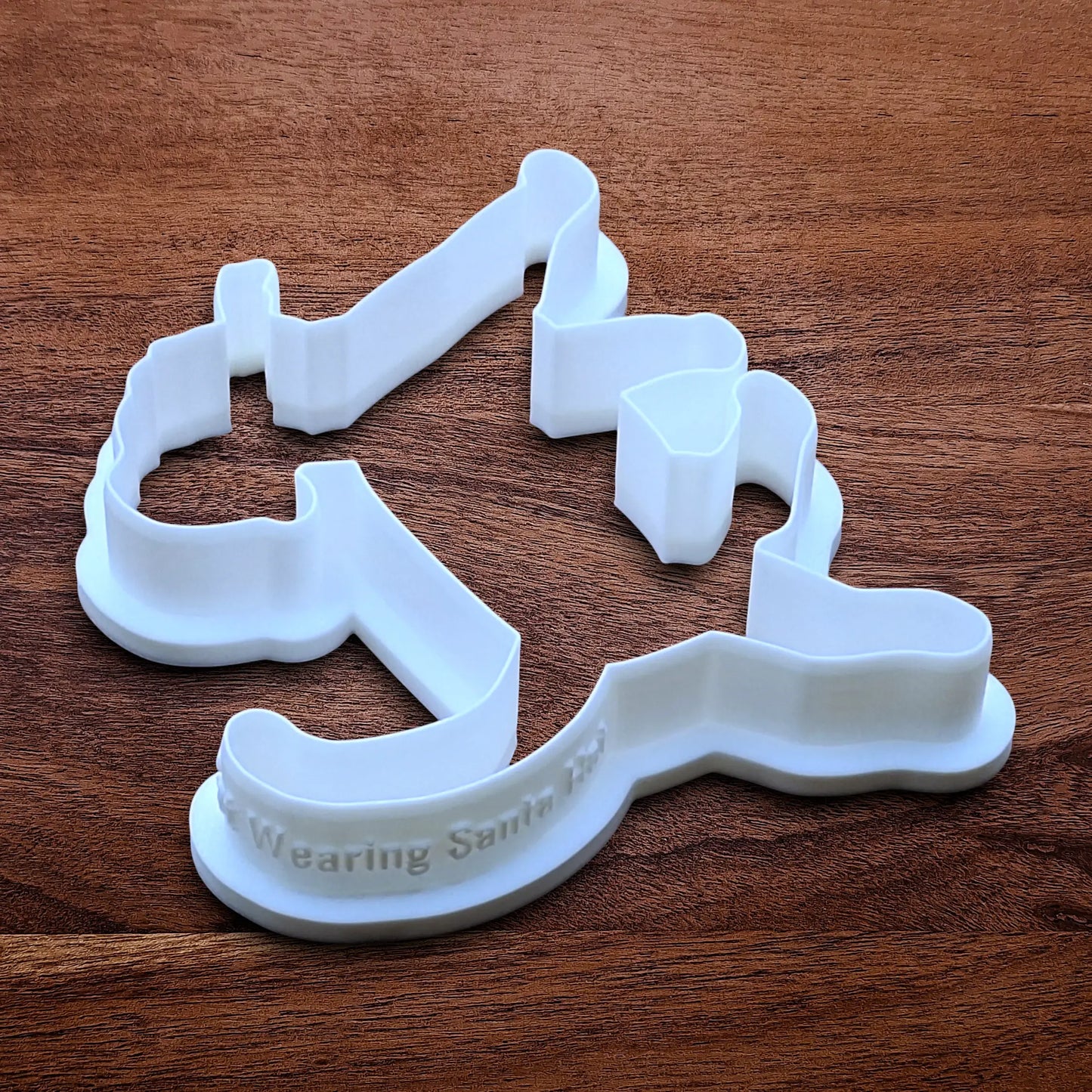 Funny Santa Hat Cat Butt Cookie Cutter and Stamp, available in a 3-piece set or individual sizes, perfect for baking, fondant, crafts, gag gifts and white elephant parties.