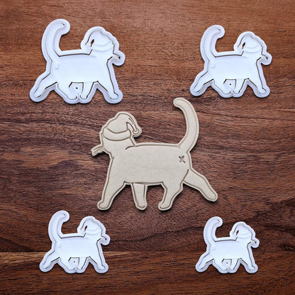 Funny Santa Hat Cat Butt Cookie Cutters and Stamps alongside a cat butt dough cutout and imprint, available in a 3-piece set or individual sizes, perfect for baking, fondant, crafts, gag gifts and white elephant parties.
