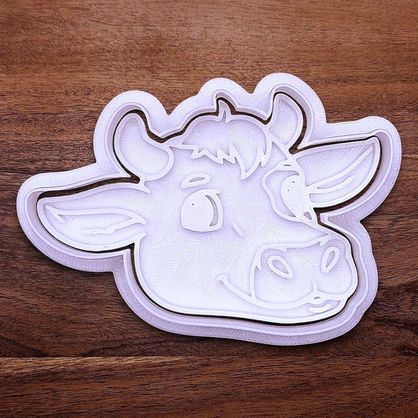 Handmade and customizable cow cookie cutter and stamp, perfect for farm-themed baking and kids’ country birthday party treats.