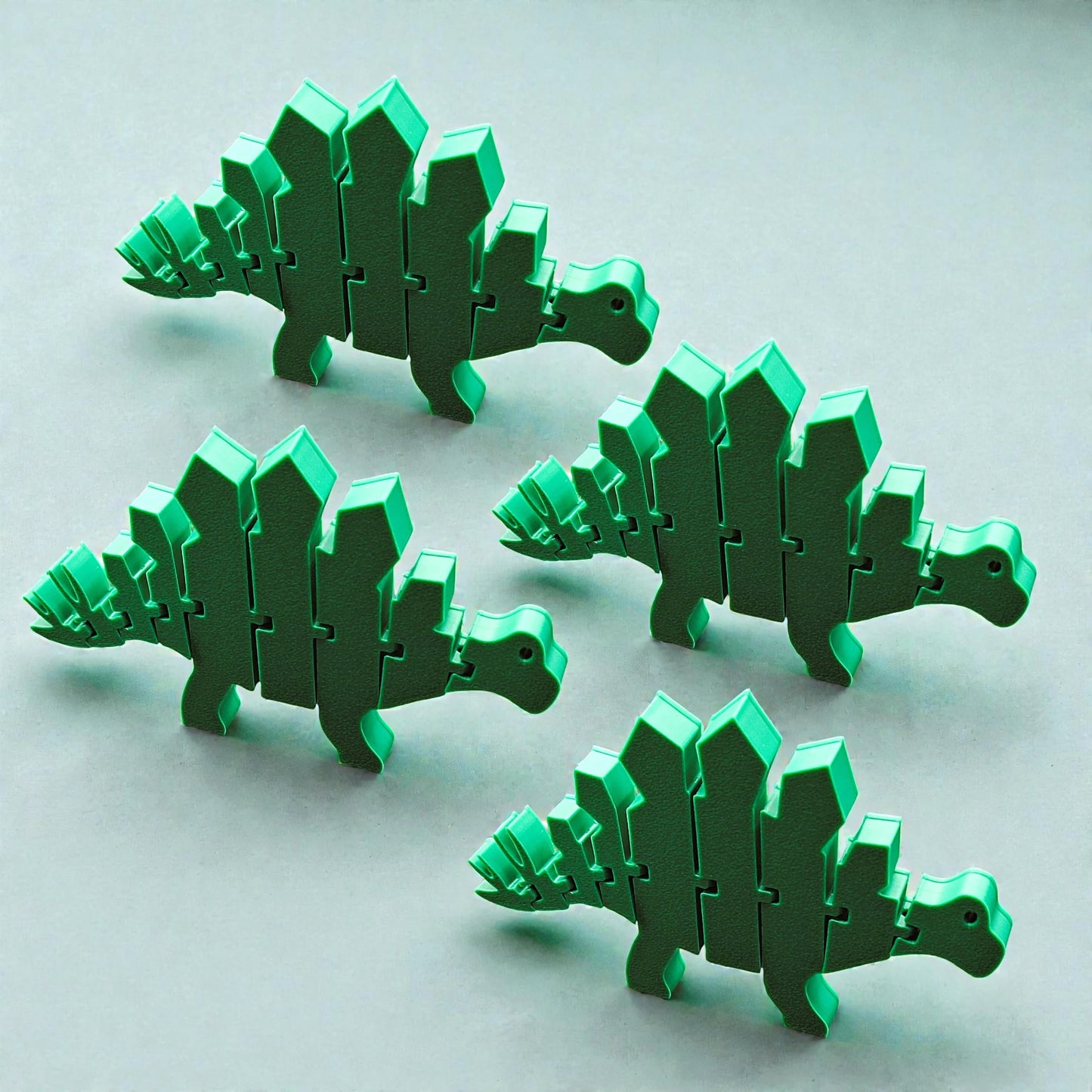 Articulated and customizable stegosaurus dino pretend play fidget toy in mistletoe green, perfect for dinosaur lovers, sensory play, stress relief, and unique gifts.